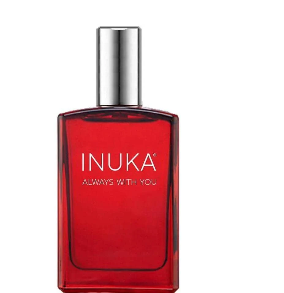 Red Inuka fragrance bottle with a silver cap